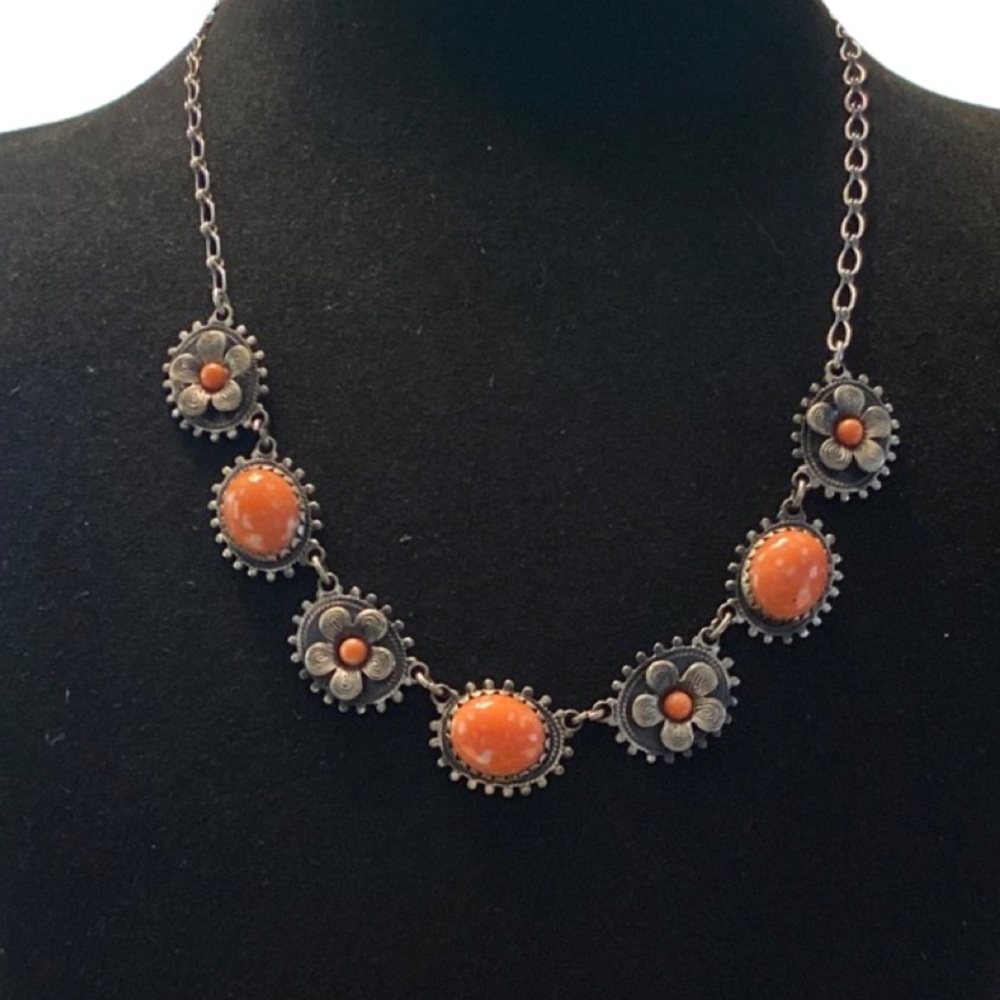 Sweet gunmetal tone necklace with faux coral accents